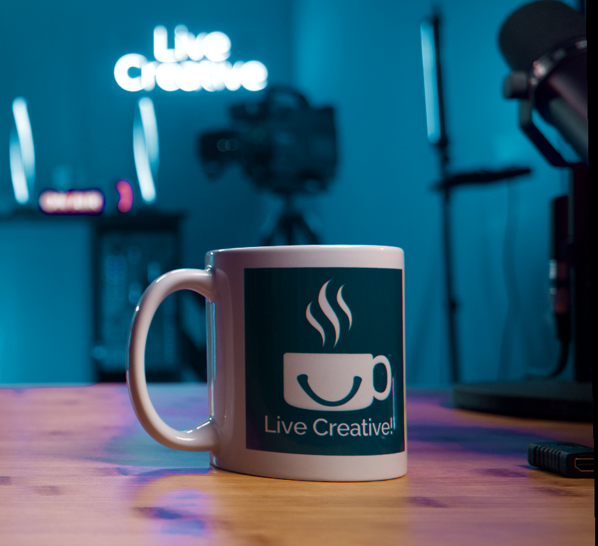 Live Creative Cuppy coffee mug sits on a stduio desk